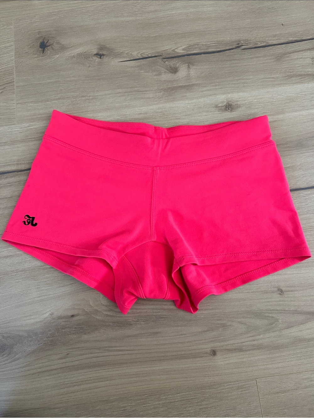 High-Rise Neon Pink Athletic Shorts with Subtle Logo